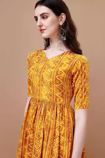YELLOW BANDHANI FOLI PRINT DESIGN WORK WITH RAYON FABRIC KURTI 