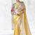 cream & yellow faux organza saree with floral printed blouse & zari border