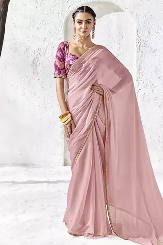 light pink faux georgette saree with golden zari border