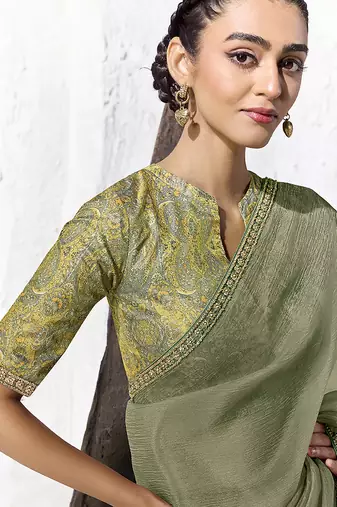 olive green faux georgette embroidered saree with designer blouse