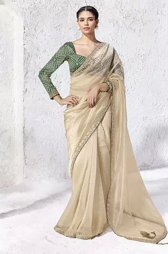 cream faux organza saree with zari border & green printed blouse