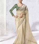 cream faux organza saree with zari border & green printed blouse
