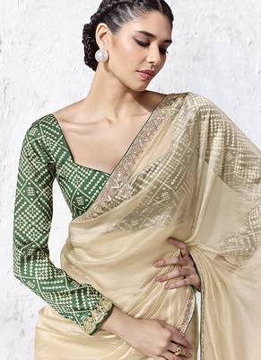 cream faux organza saree with zari border & green printed blouse 2