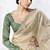 cream faux organza saree with zari border & green printed blouse