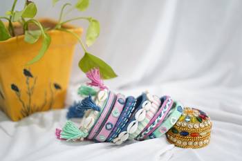  handcrafted pastel multicolour thread bangle set with cowrie shells & tassels 1