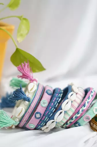  handcrafted pastel multicolour thread bangle set with cowrie shells & tassels