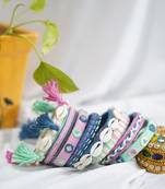  handcrafted pastel multicolour thread bangle set with cowrie shells & tassels