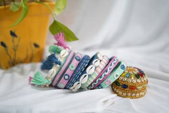 handcrafted pastel multicolour thread bangle set with cowrie shells & tassels 2