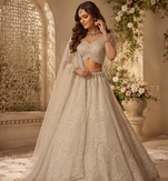 off white color Motif Crystal and Sequins work net Lehenga Choli set