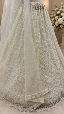 off white color Motif Crystal and Sequins work net Lehenga Choli set 4