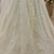 off white color Motif Crystal and Sequins work net Lehenga Choli set