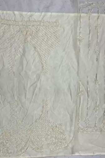 off white color Motif Crystal and Sequins work net Lehenga Choli set