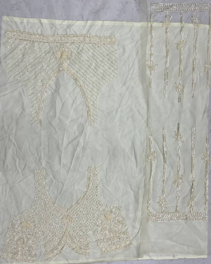 off white color Motif Crystal and Sequins work net Lehenga Choli set