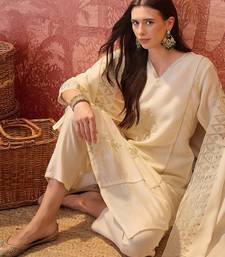 Cream chanderi cotton embroidered kurta set.