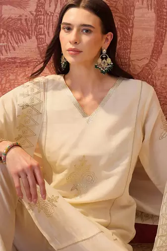 Cream chanderi cotton embroidered kurta set.