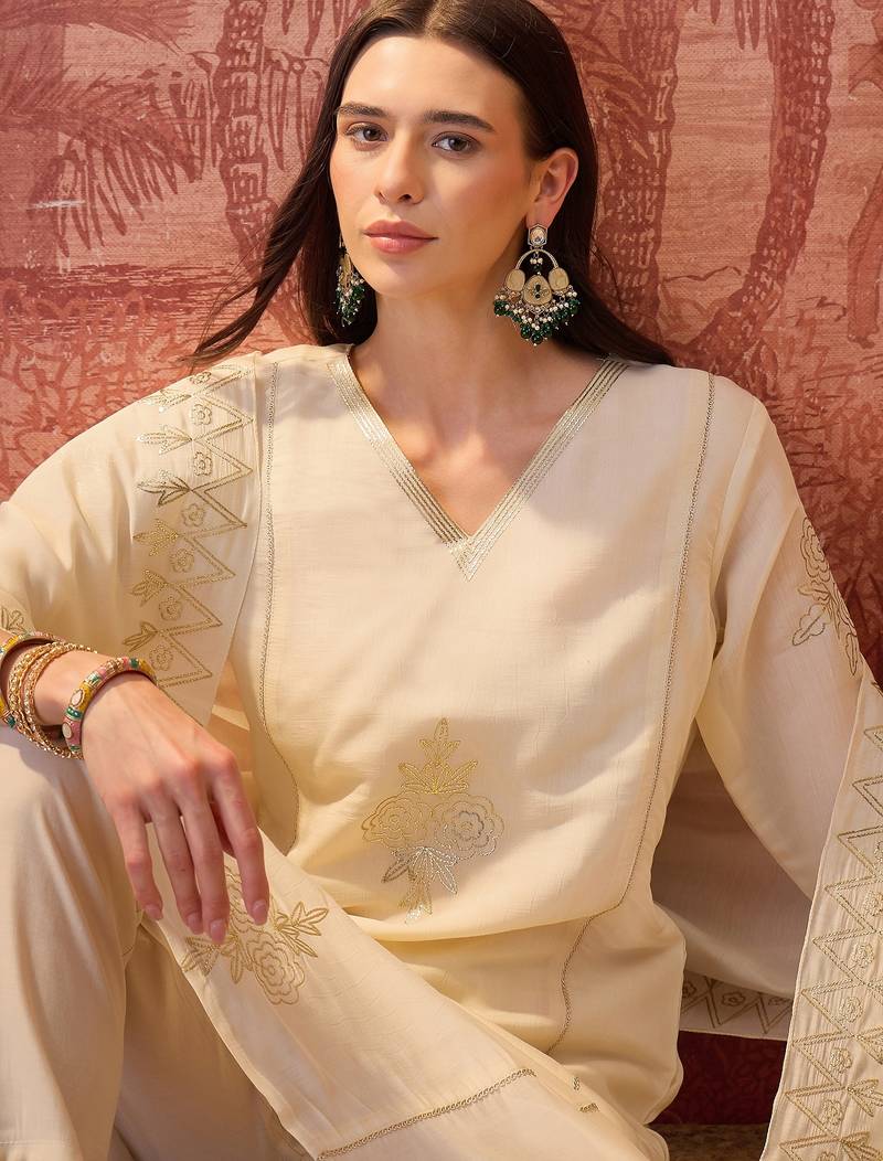 Cream chanderi cotton embroidered kurta set.