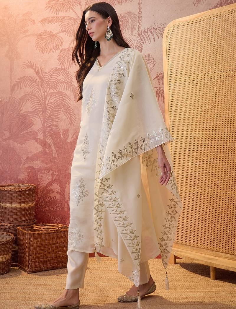 Cream chanderi cotton embroidered kurta set.