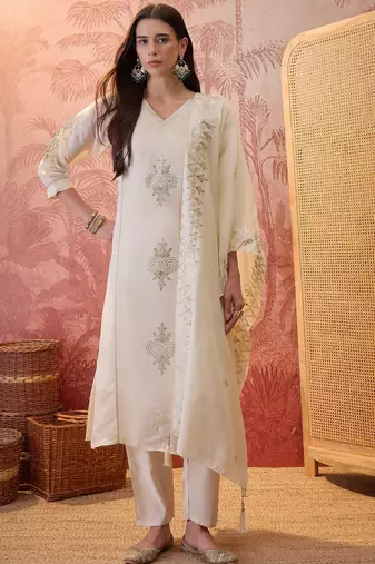 Cream chanderi cotton embroidered kurta set.