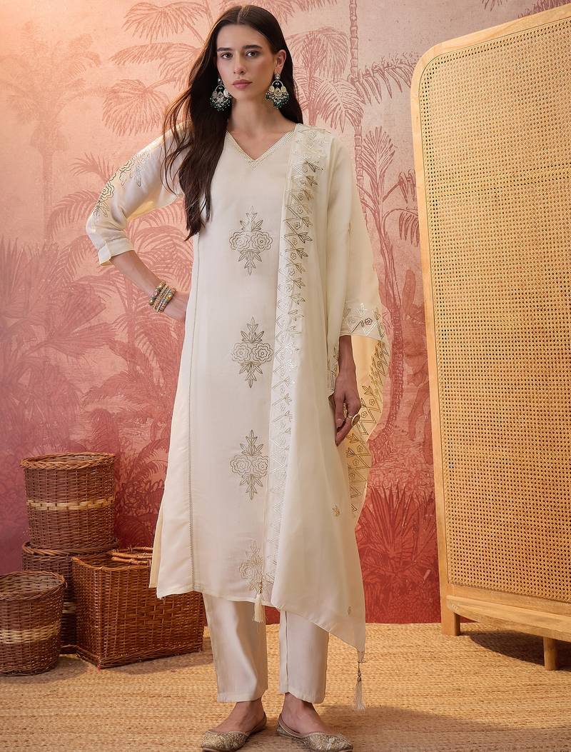 Cream chanderi cotton embroidered kurta set.
