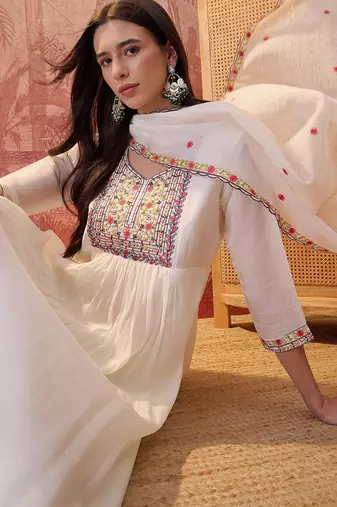 Cream chanderi cotton embroidered kurta set.