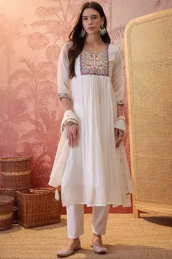 Cream chanderi cotton embroidered kurta set.