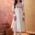 Cream chanderi cotton embroidered kurta set.