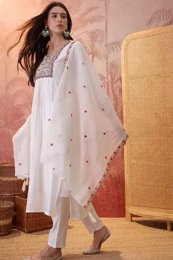 Cream chanderi cotton embroidered kurta set.