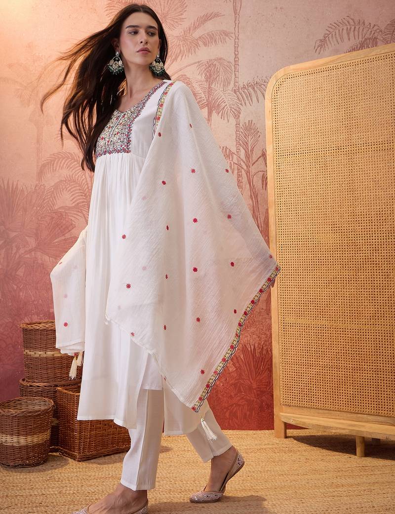 Cream chanderi cotton embroidered kurta set.