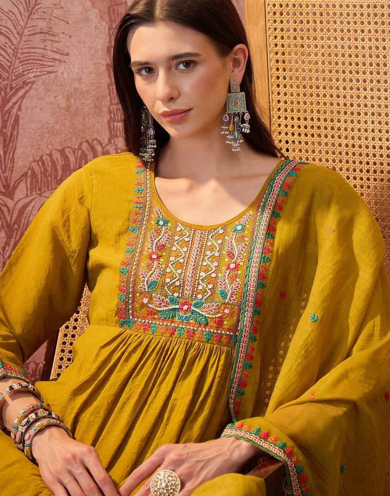 Olive chanderi cotton embroidered kurta set.