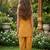 Mustard and golden printed cotton festive wear kurta set