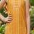 Mustard and golden printed cotton festive wear kurta set