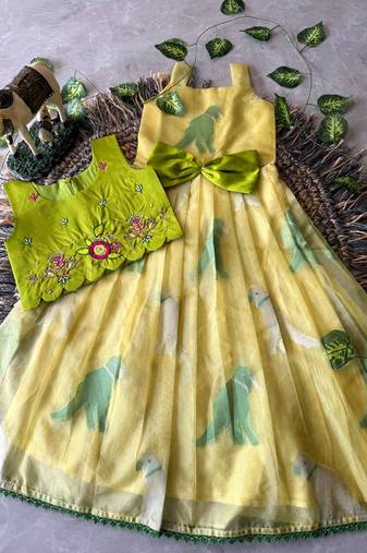 Kids yellow soft organza zari weaving gown with raw silk maggam embroidery work koti