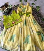 Kids yellow soft organza zari weaving gown with raw silk maggam embroidery work koti