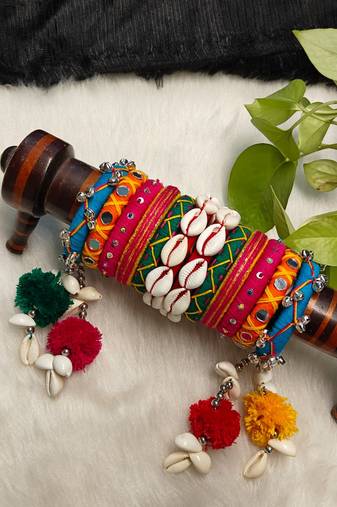  handcrafted multicolour navratri thread bangle set with cowrie shells & pom-poms