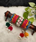  handcrafted multicolour navratri thread bangle set with cowrie shells & pom-poms