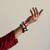  multicolour thread-wrapped cowrie shell bangle set