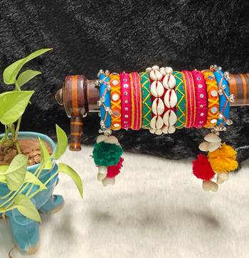  handcrafted multicolour navratri thread bangle set with cowrie shells & pom-poms 2