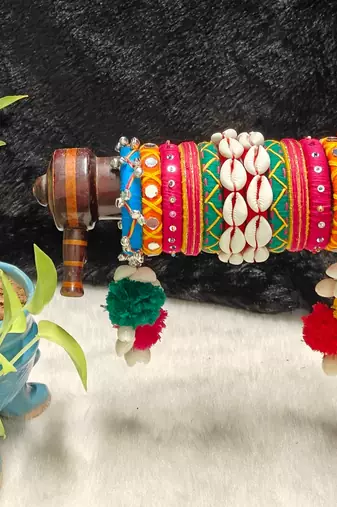 handcrafted multicolour navratri thread bangle set with cowrie shells & pom-poms