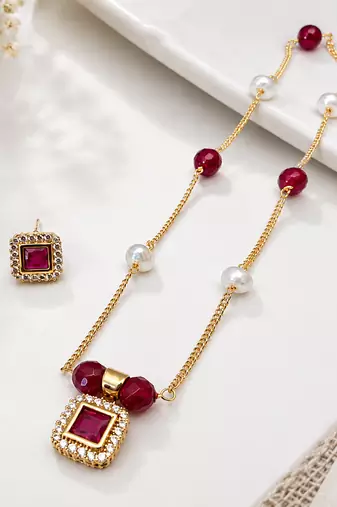 Gold-toned ruby red beaded pendant necklace and earrings set pearl accents, square cz pendant, festive wear, gold chain