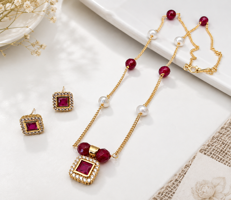 Gold-toned ruby red beaded pendant necklace and earrings set pearl accents, square cz pendant, festive wear, gold chain