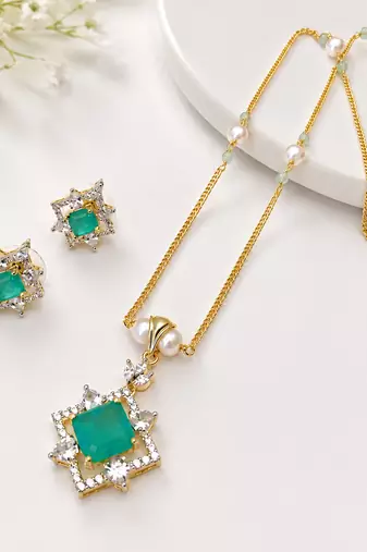 Emerald green cz pendant necklace and earrings jewellery set pearl beaded chain, star-shaped pendant, cz stone accents.
