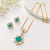 Emerald green cz pendant necklace and earrings jewellery set pearl beaded chain, star-shaped pendant, cz stone accents.