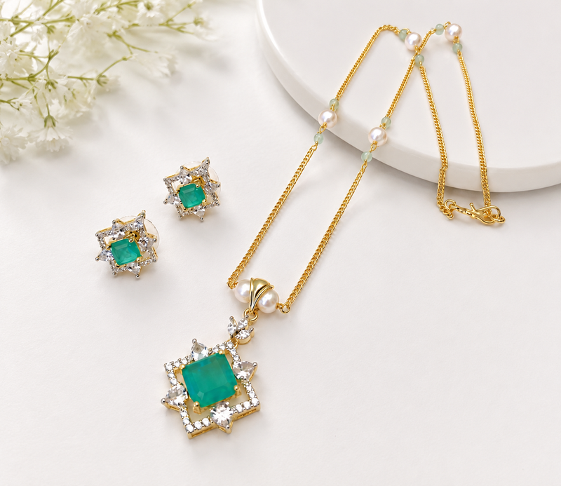 Emerald green cz pendant necklace and earrings jewellery set pearl beaded chain, star-shaped pendant, cz stone accents.