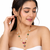 Gold-toned floral pendant necklace & earrings jewellery set ruby & emerald beads, pearl accents, multicolour stone chain
