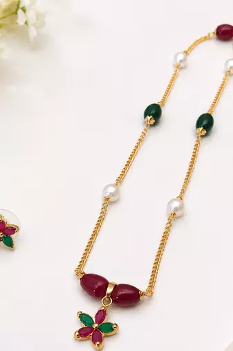 Gold-toned floral pendant necklace & earrings jewellery set ruby & emerald beads, pearl accents, multicolour stone chain