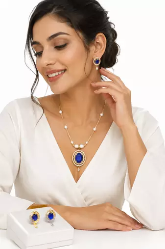 Blue oval stone pendant necklace and earrings jewellery set pearl chain, cz stone accents, festive wear.