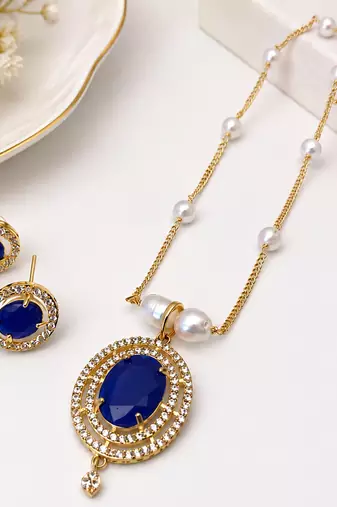 Blue oval stone pendant necklace and earrings jewellery set pearl chain, cz stone accents, festive wear.