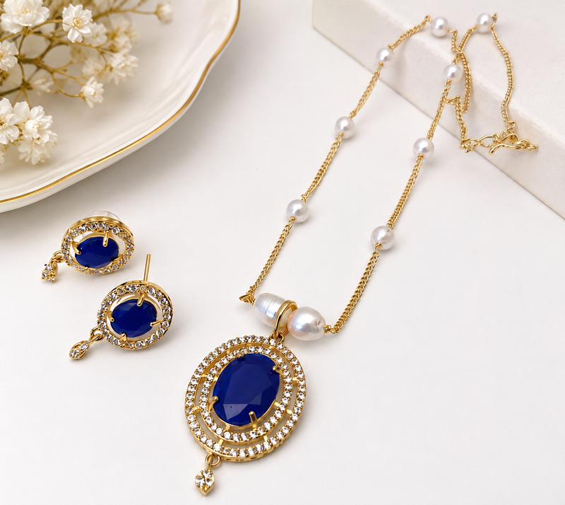 Blue oval stone pendant necklace and earrings jewellery set pearl chain, cz stone accents, festive wear.