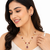 Red crystal & pearl pendant necklace and earrings jewellery set oval cz pendant, pearl beaded gold-tone finish.