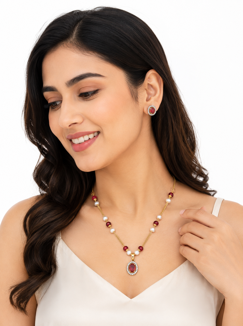 Red crystal & pearl pendant necklace and earrings jewellery set oval cz pendant, pearl beaded gold-tone finish.
